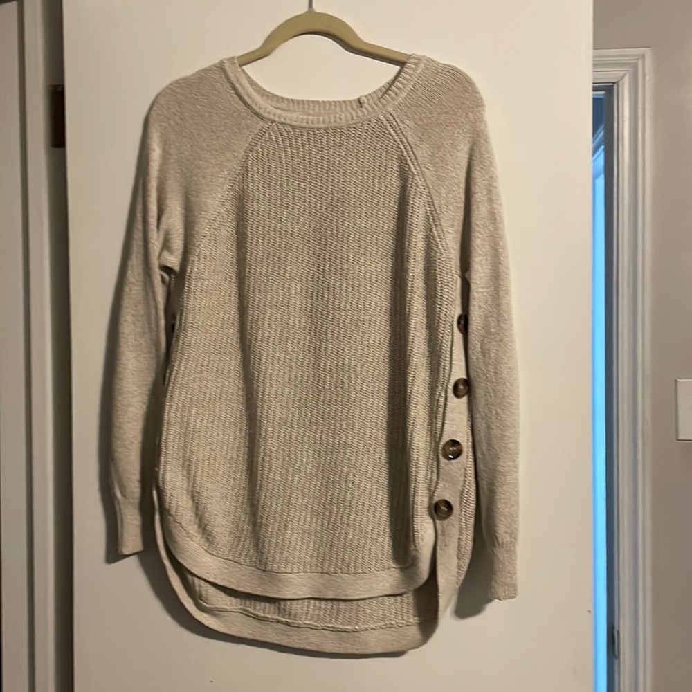 Beige sweater with buttons on sides